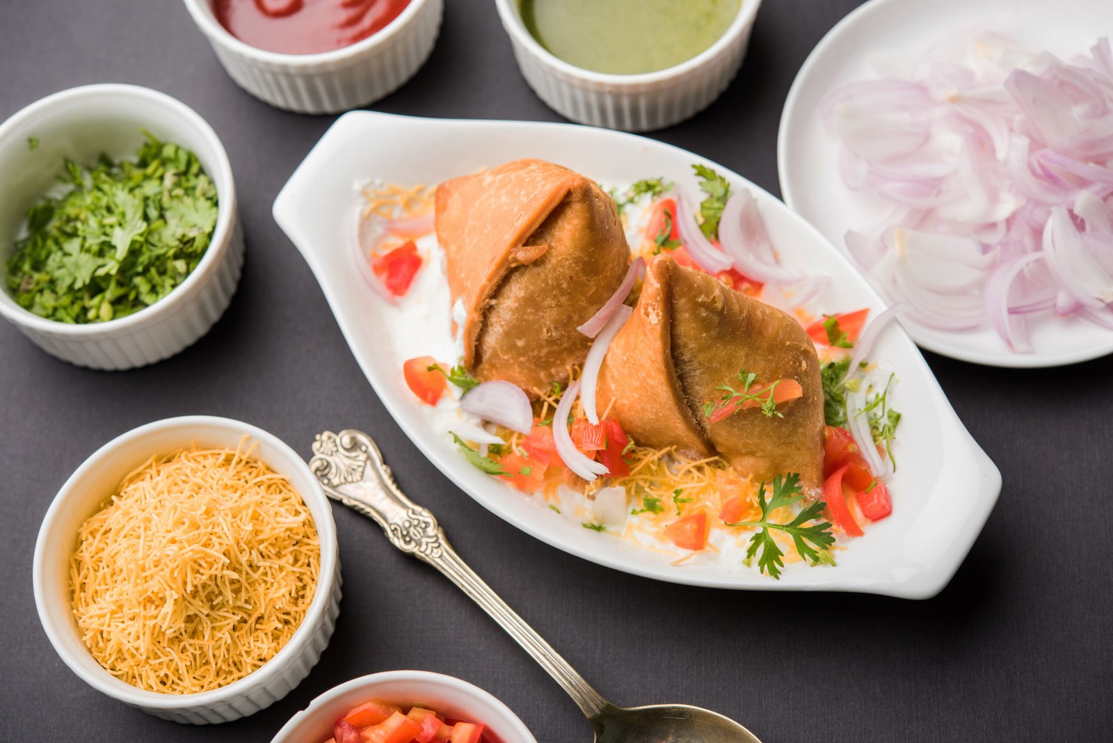 Samosa chaat with chutneys and toppings