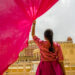 Woman inside the Hawa Mahal, also known as the Palace of the Wind, in Jaipur, Rajasthan, India.