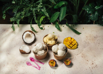 Bowls of tropical ice cream with coconut, mango, and passionfruit.