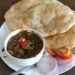Chole bhature with chickpea curry and salad.