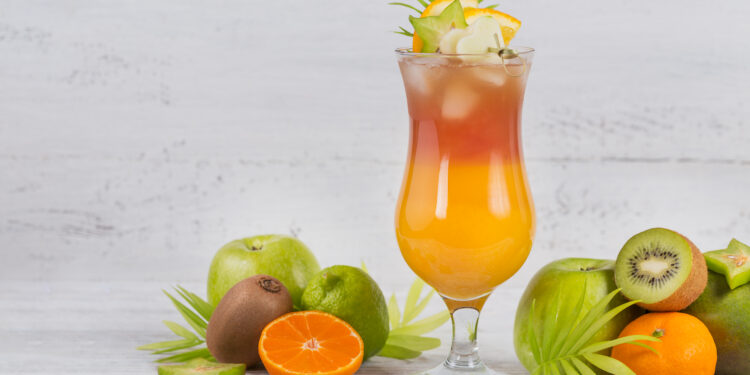 Tropical summer drink with fresh fruit garnish.