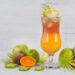 Tropical summer drink with fresh fruit garnish.