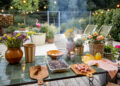 Outdoor garden table set for a barbecue with flowers, food, and summer decor.