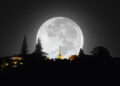 A glowing full moon over a calm Caribbean night sky, with a traditional bowl of kheer placed outdoors, symbolising the Indo-Caribbean celebration of Sharad Purnima.