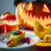 A festive Indo-Caribbean Halloween table with pumpkin curry, candles, and Caribbean-Indian decorations.