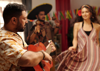 A vibrant collage depicting the fusion of Bollywood and reggae music influences, showing film reels, musical notes, and cultural symbols representing South Asian and Caribbean diasporas.