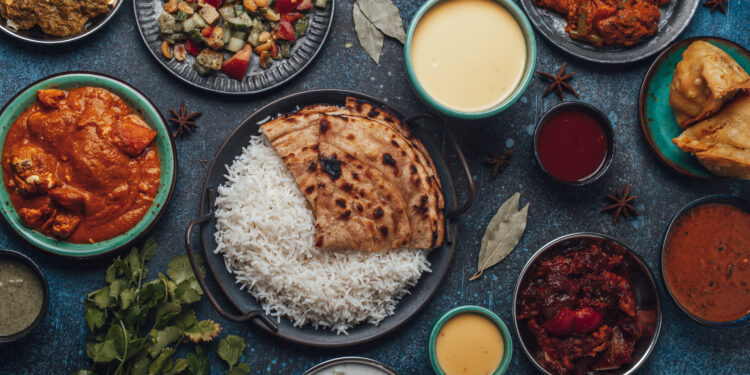 simple vegetarian food during a Sikh langar, highlighting the role of communal meals in Sikh celebrations.