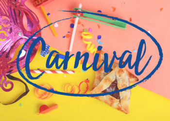 Colourful Trinidad Carnival street food stall serving doubles, pholourie, and corn soup with vibrant festival decorations and crowds in the background.