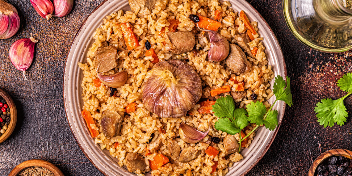 Trinidad pelau rice with chicken, carrots and spices served in a bowl, a classic Caribbean one-pot meal