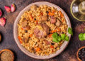 Trinidad pelau rice with chicken, carrots and spices served in a bowl, a classic Caribbean one-pot meal