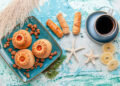 Assorted Indo-Caribbean desserts including coconut drops, sugar cakes and traditional mithai made with coconut, spices and brown sugar.